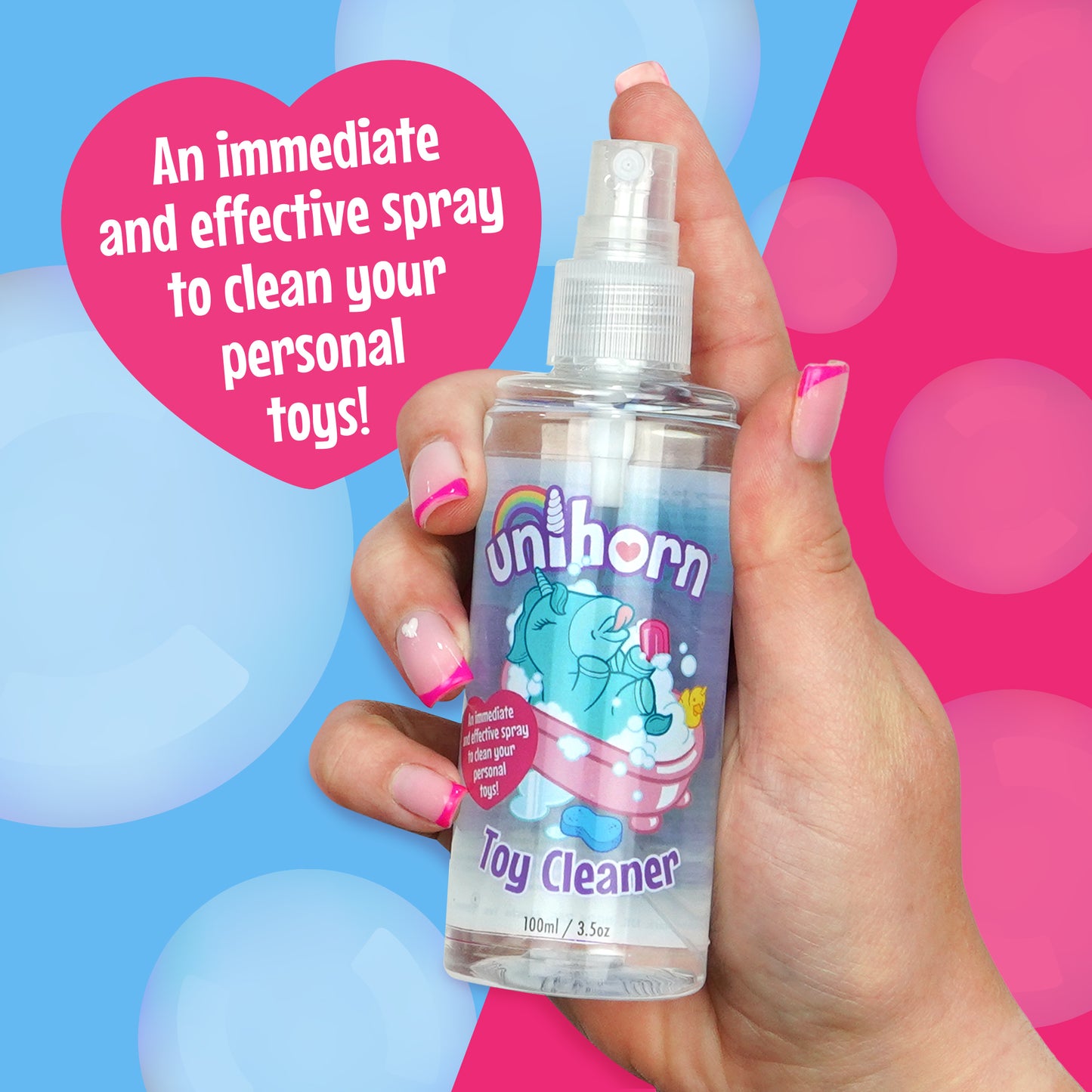 Hand holding Unihorn Toy Cleaner with no lid on next to a pink heart with the text "An immediate and effective spray to clean your personal toys!" all on a blue and pink background