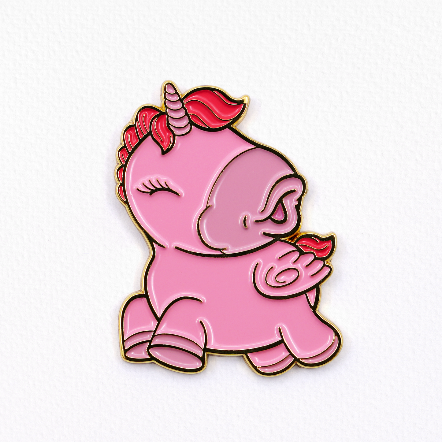 Heart Throb pin badge on a textured white background