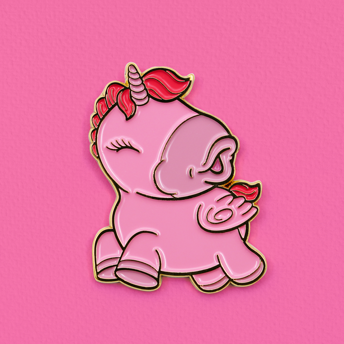 Pink Heart Throb pin badge on a texture bright pink background