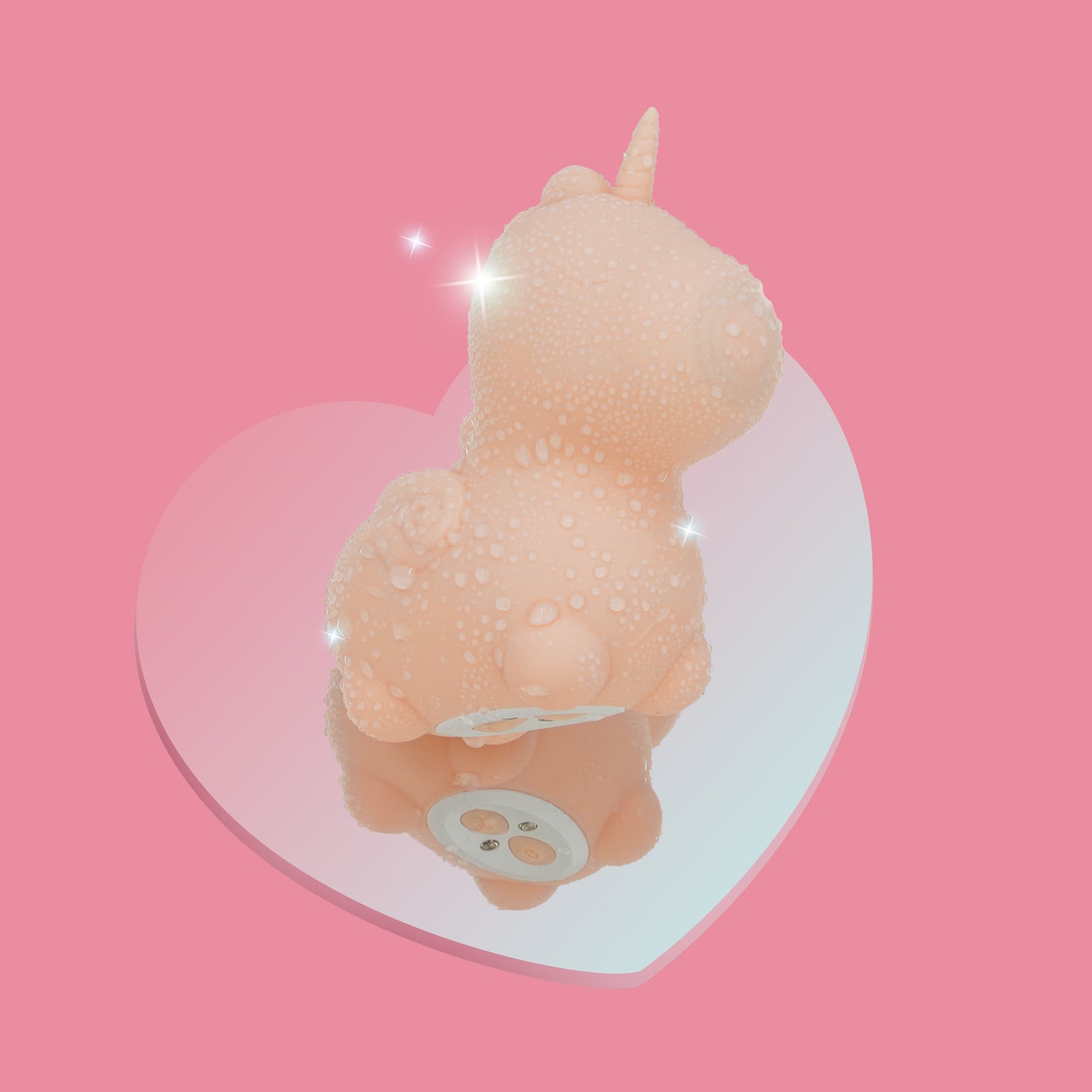 Heart Throb Unihorn clitoral vibrator covered in water droplets on a mirrored heart with a pink background
