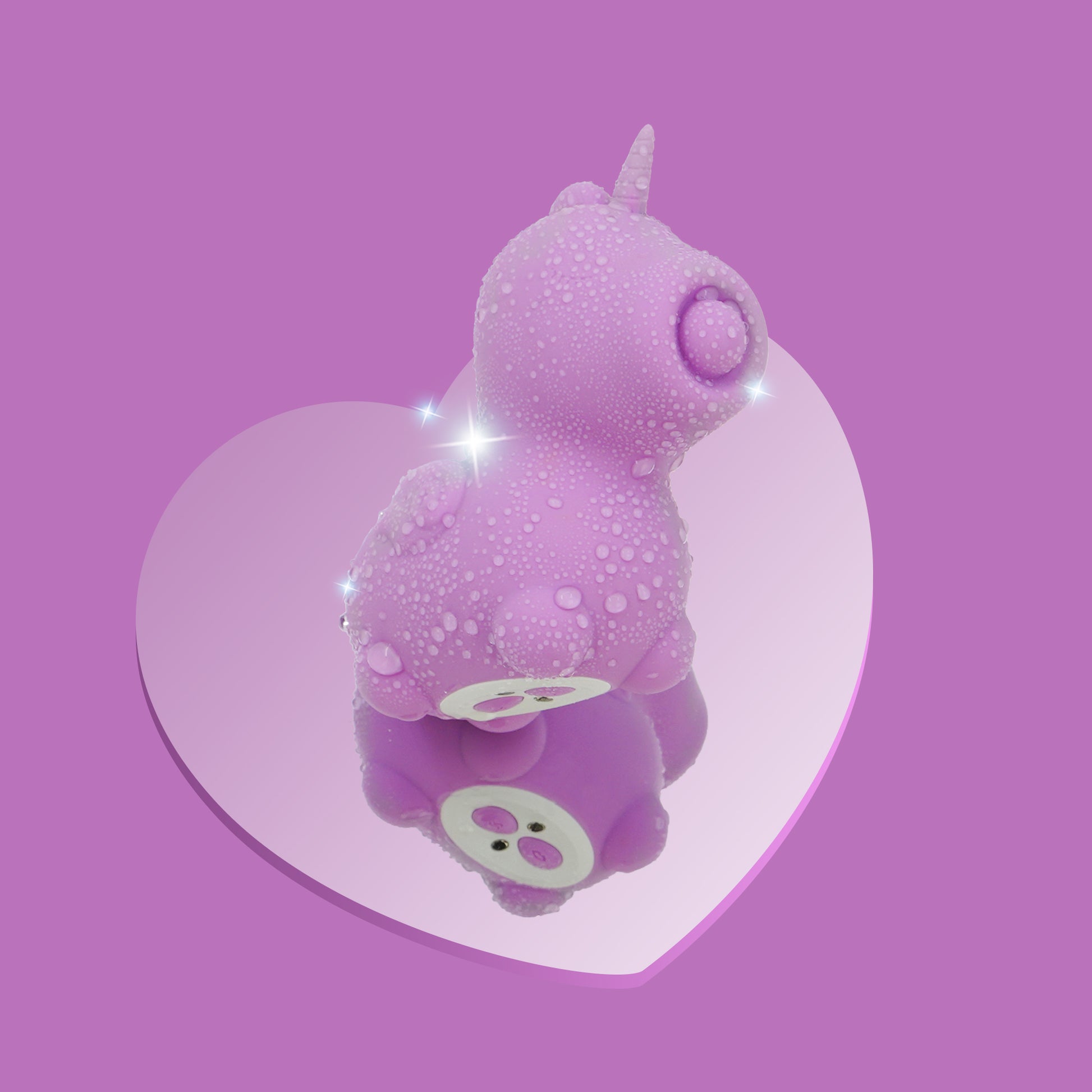 Karma Lilac purple Unihorn vibrator covered in water droplets on a mirrored heart on a purple background