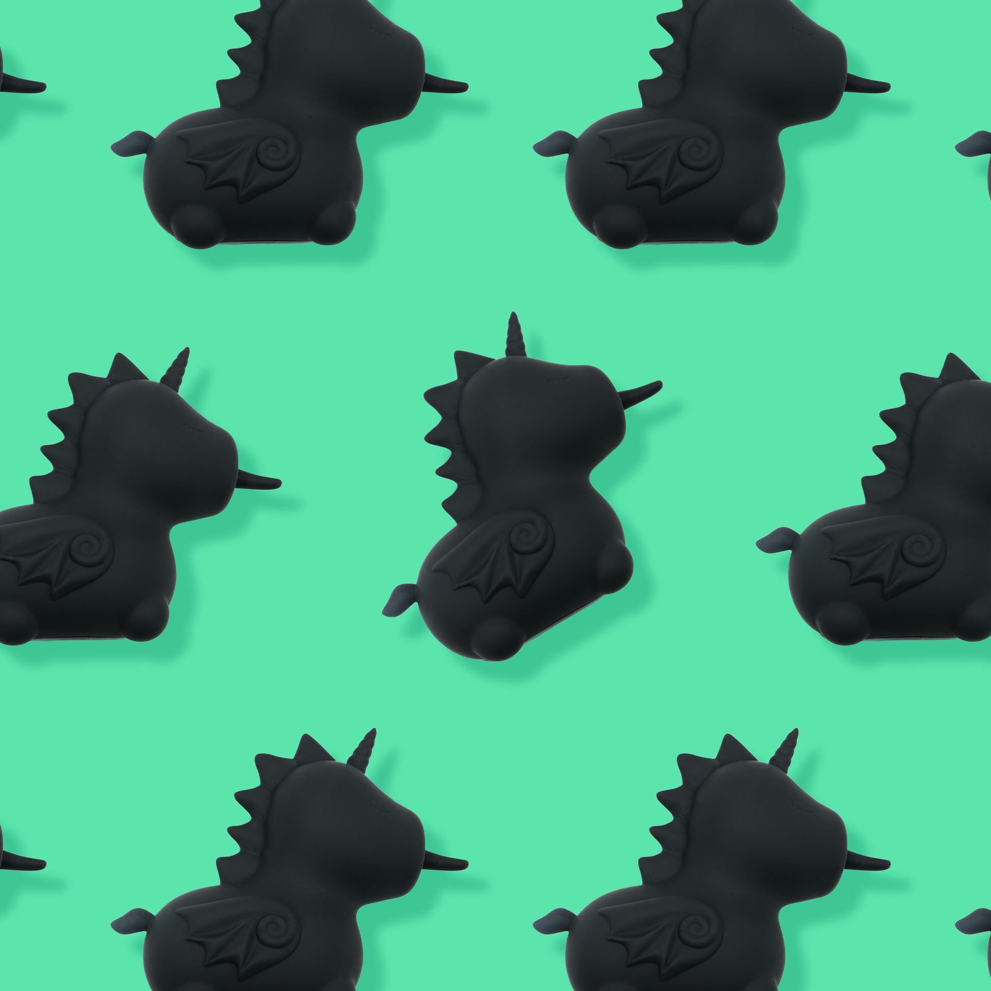 7 Wild Spirit vibrators spaced evenly on a bright green background