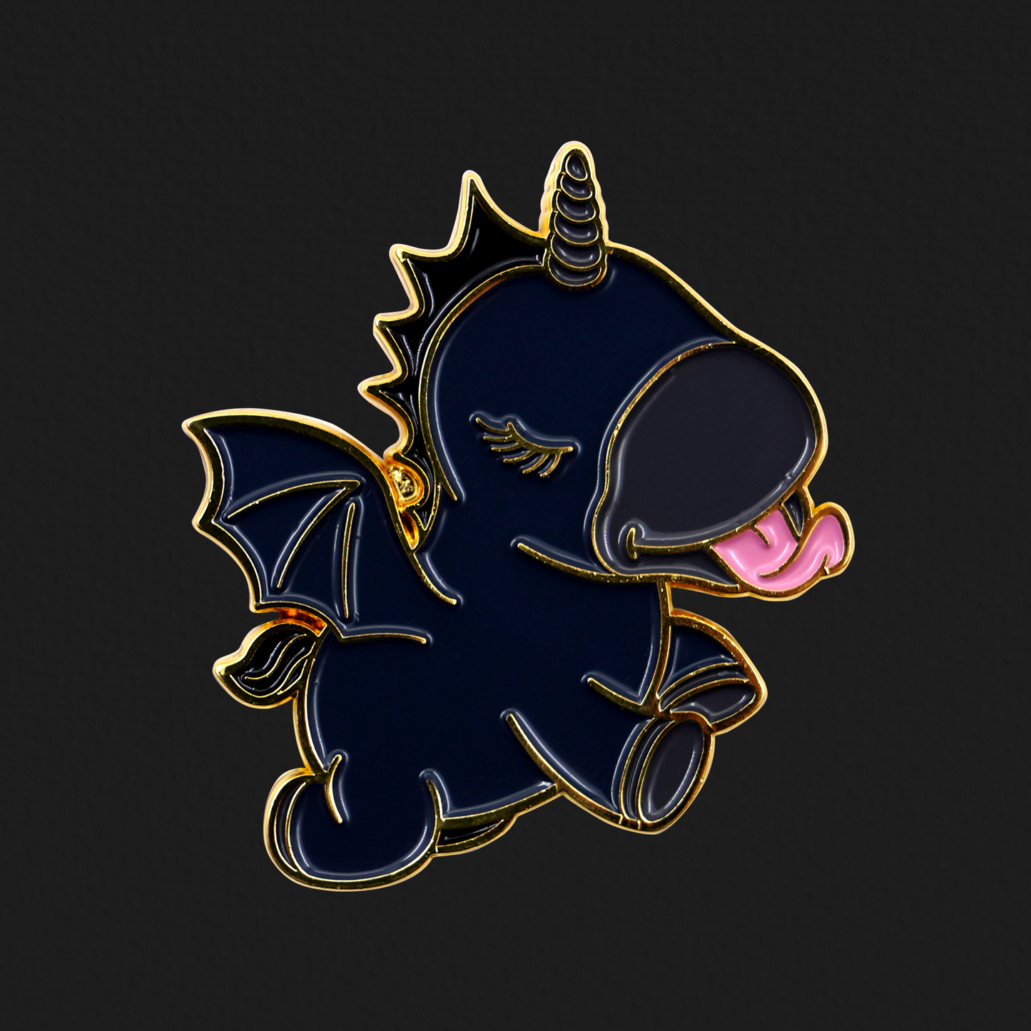 Black Wild Spirit pin badge on a faded black background